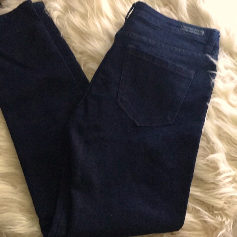 Blank dark wash denim low rise skinny jeans.